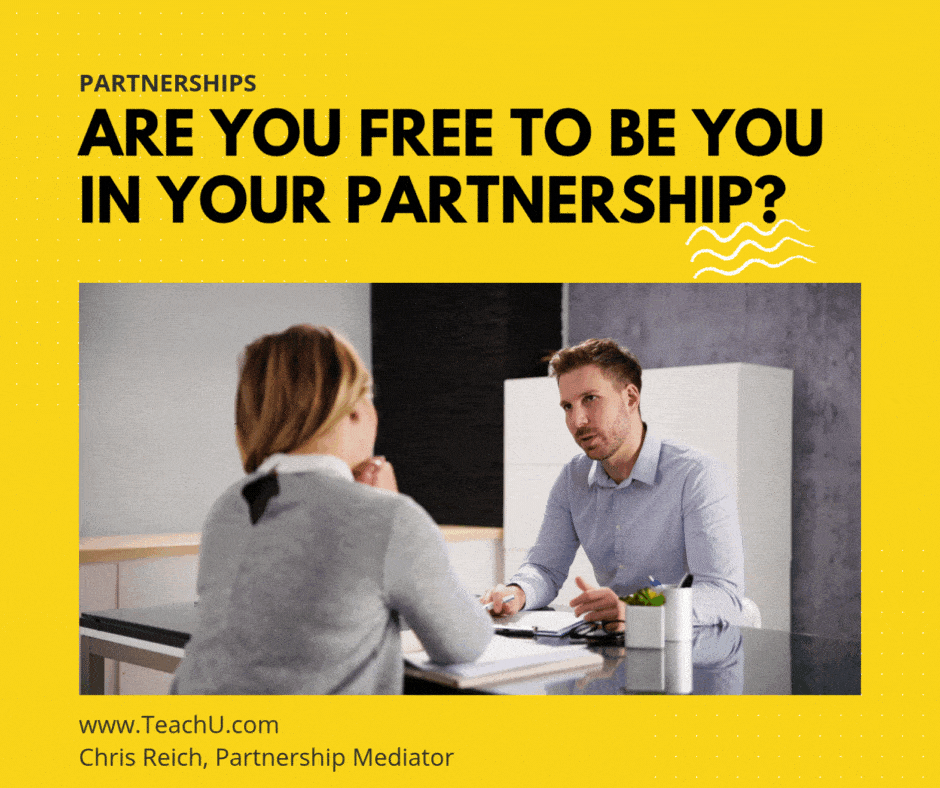 Business partners having a discussion across a desk. Scene feels tense